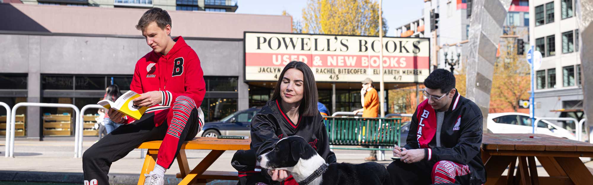 People in front of Powell's Bookstore wearing Blazers gear.