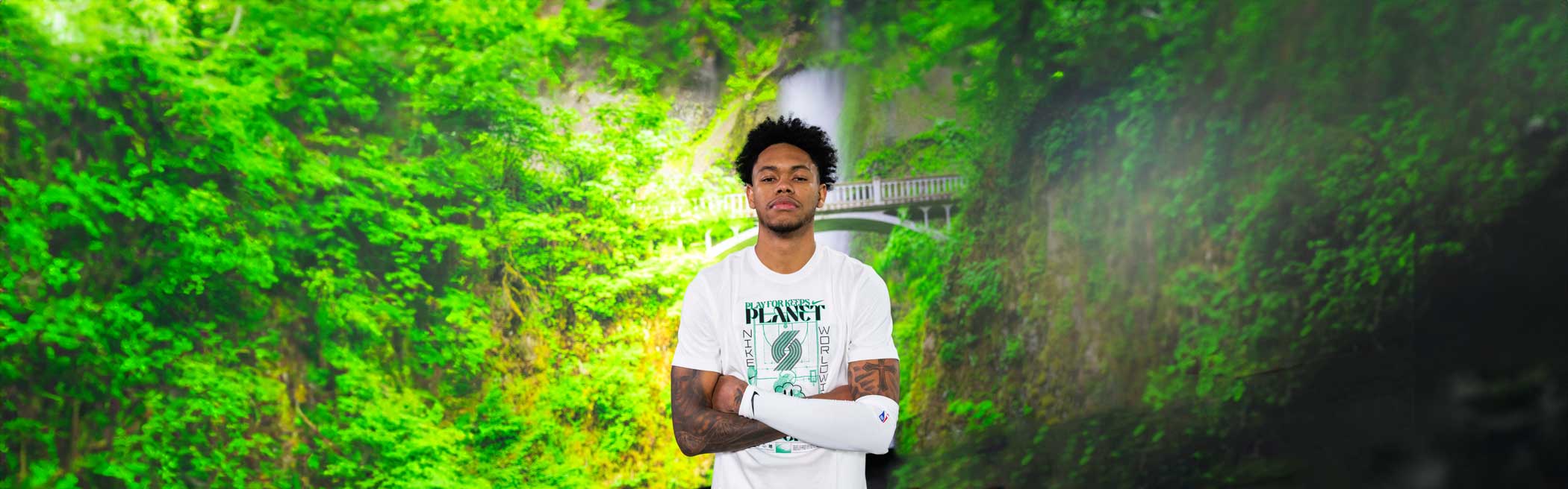 Anfernee in our Green Planet Nike Shirt