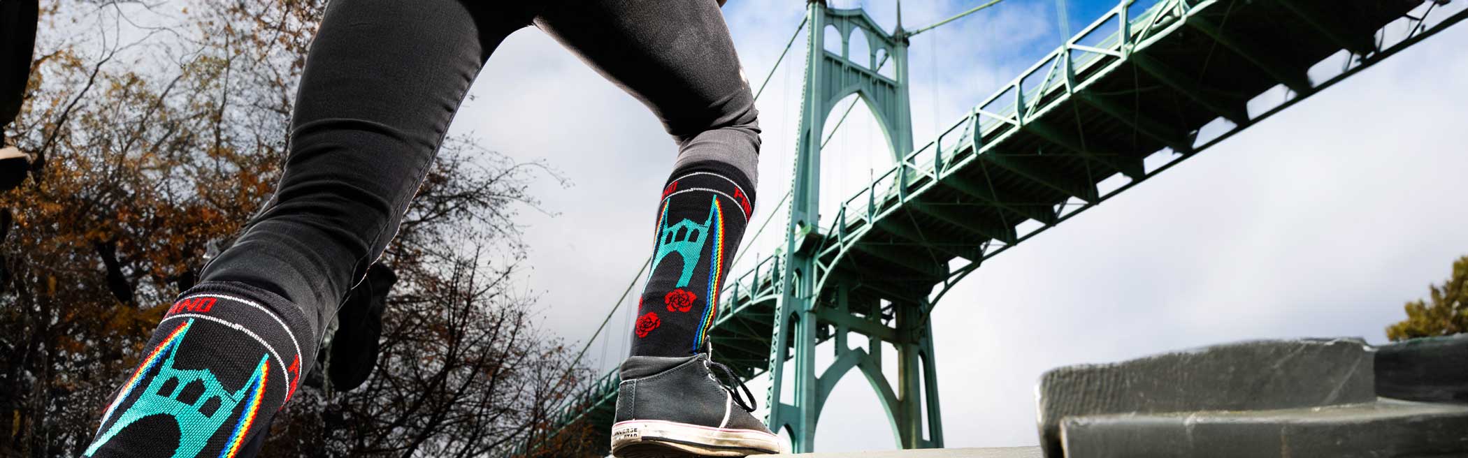 Socks on person in front of St Johns Bridge