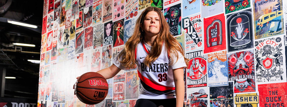 Girl dribbling ball.