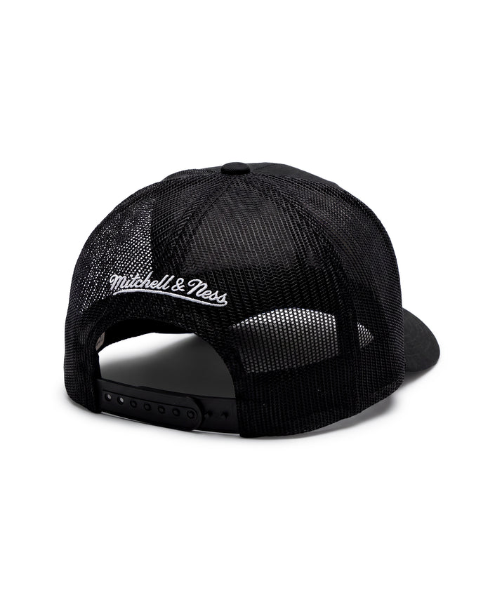 A black Mitchell & Ness trucker cap shown from the back, featuring a black mesh back and a white embroidered logo on the left side, set against a plain white background.