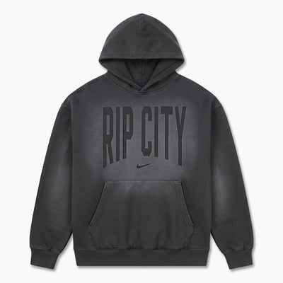 A dark gray washed pullover hoodie with 'RIP CITY' printed in arched block letters and a small Nike swoosh underneath, displayed on a clean white background.