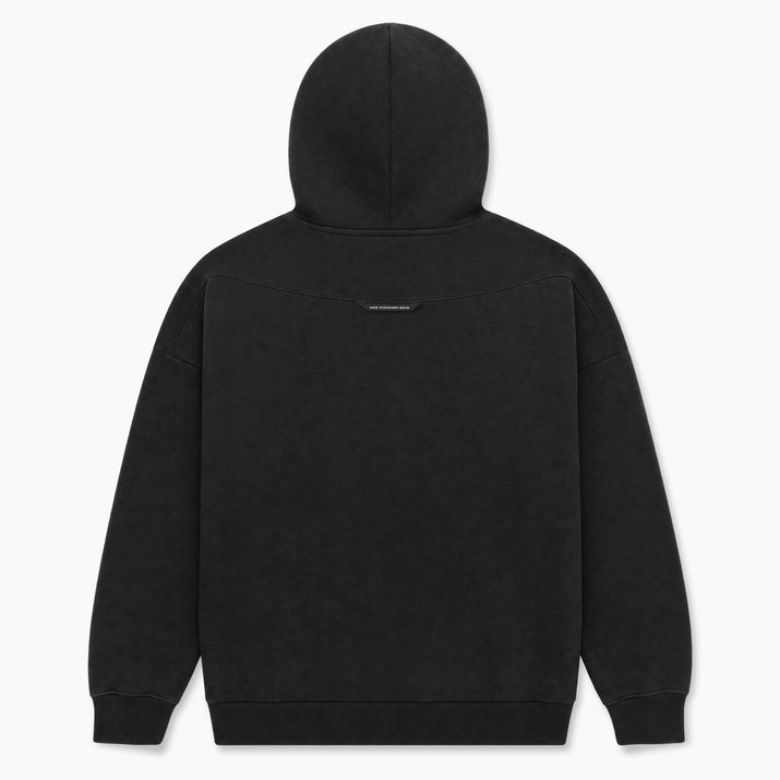 A black hooded sweatshirt shown from the back, featuring a subtle tonal embroidered logo on the upper back, set against a clean white background.
