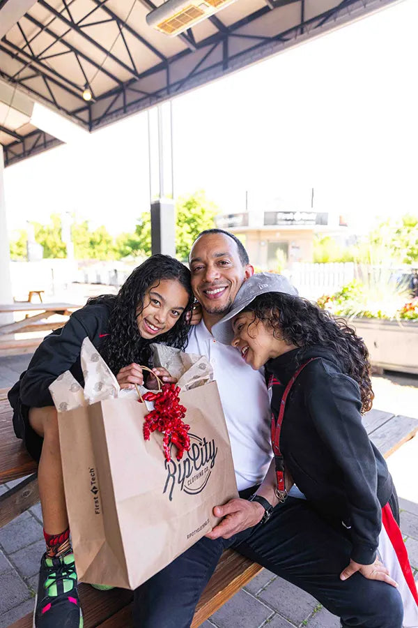 Father getting Rip City gifts from his daughters