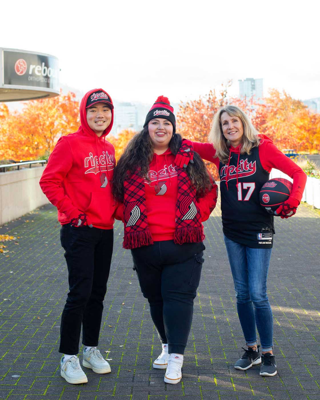 Group of Blazers fans at Moda Center wearing Plaid City gear