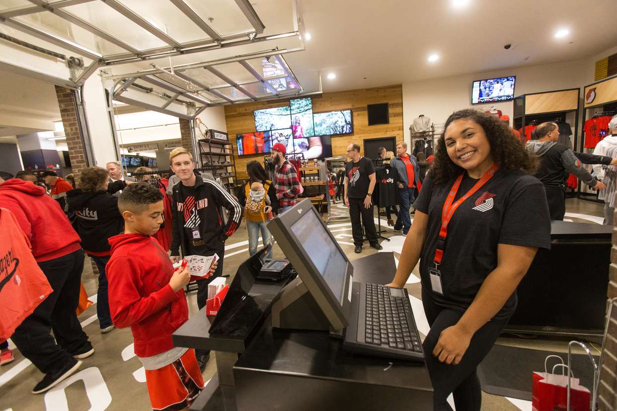 woman at cash register in rip city clothing store
